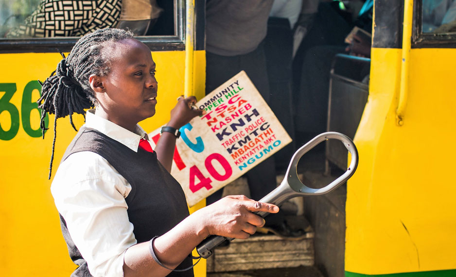 A woman working with public transport in East Africa.